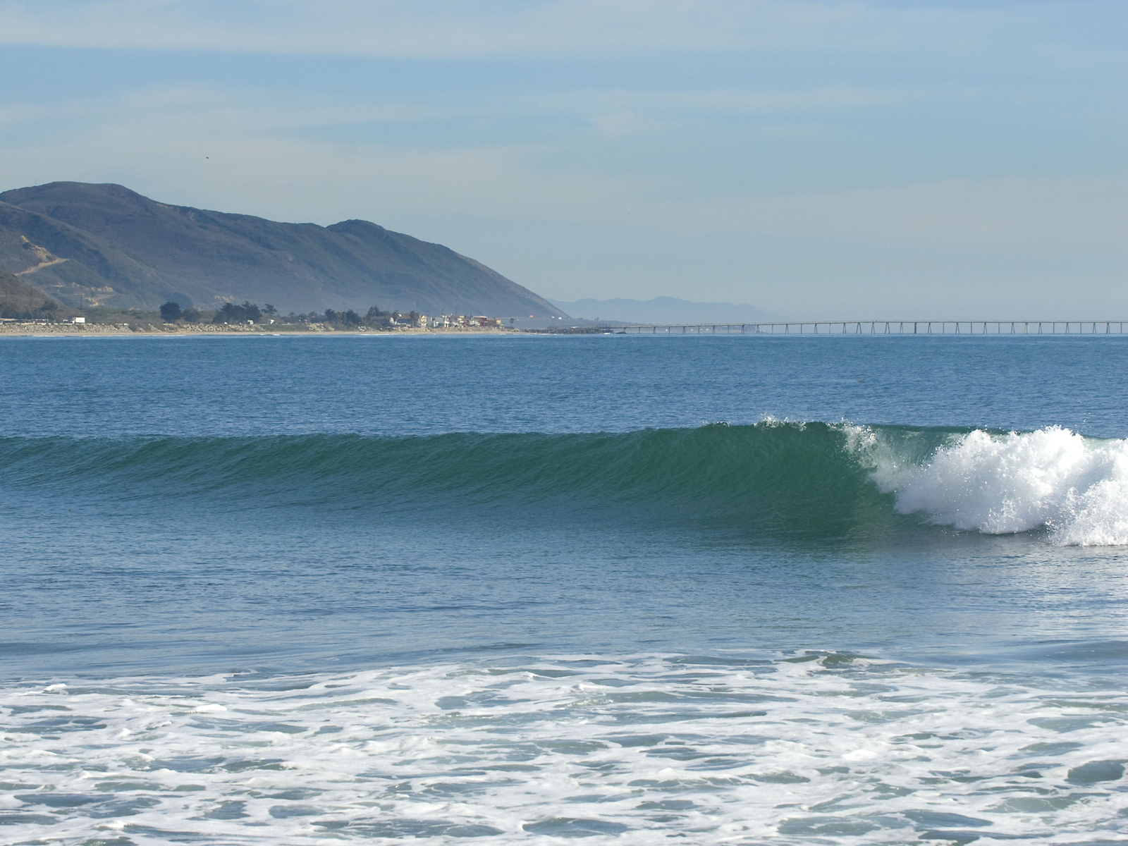 Image: Rare uncrowded wave breaks near Carpinteria California at Rincon Point. Photo: Copyright Nordyke Creative 2009